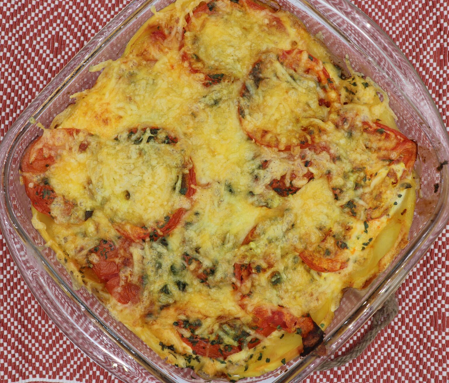 This image depicts the bright, cheesy egg and vegetable casserole